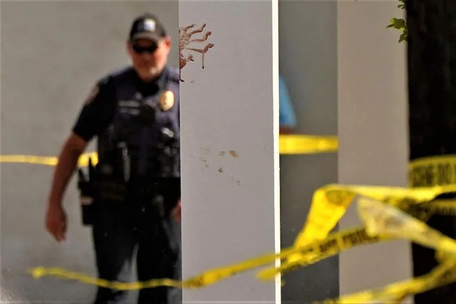 A bloody handprint marks a pillar the day after a shooting during a teenager's birthday party at MahoganyMasterpiece Dance Studio in Dadeville, Alabama, U.S. April 16, 2023. (Photo by Cheney Orr/Reuters)