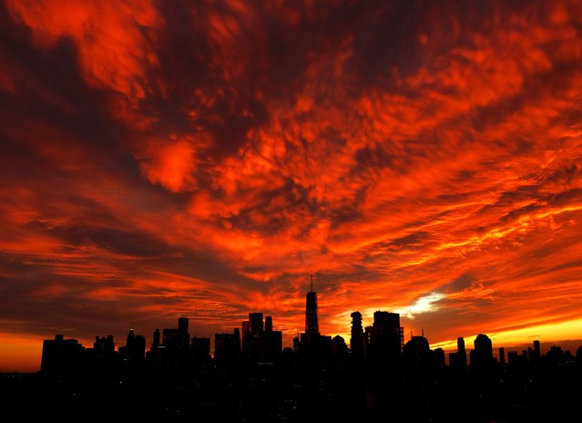 Clouds turn shades of red and orange when the sun sets behind One World Trade Center and the Manhattan skyline on Wednesday, November 5, 2025 in New York City. (Photo by John Angelillo/UPI/Rex Features/Shutterstock)