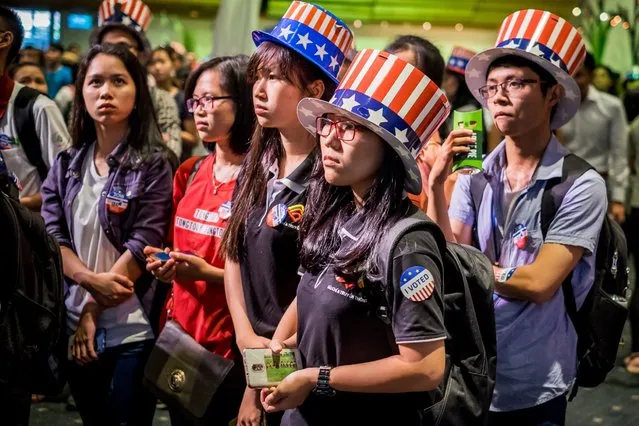 People watch live election results hosted by the United States Consulate General at a convention center, November 9, 2016, in Ho Chi Minh City, Vietnam. (Photo by Linh Pham/Getty Images)