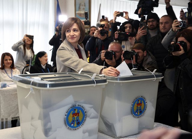 Moldova's incumbent President and presidential candidate Maia Sandu casts her ballots at a polling station, as the country holds a presidential election and a referendum on joining the European Union, in Chisinau, Moldova on October 20, 2024. Moldova's pro-EU President Maia Sandu blamed an “unprecedented assault on our country's freedom and democracy” after partial election results on Sunday showed a majority of Moldovans choosing «no» in a referendum on joining the EU. The referendum took place amid fears of vote meddling by Russia. The two votes are seen as key tests of the former Soviet republic's pro-European turn under Sandu, but have been overshadowed by accusations of Russian interference amid the war in neighbouring Ukraine. (Photo by Vladislav Culiomza/Reuters)