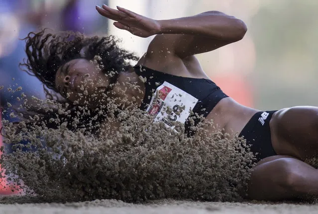 Second-place finisher Kylie Price, of the United States, lands in the pit during the women's long jump at the Harry Jerome International Track Classic in Burnaby, British Columbia, Tuesday, June 26, 2018. (Photo by Darryl Dyck/The Canadian Press via AP Photo)