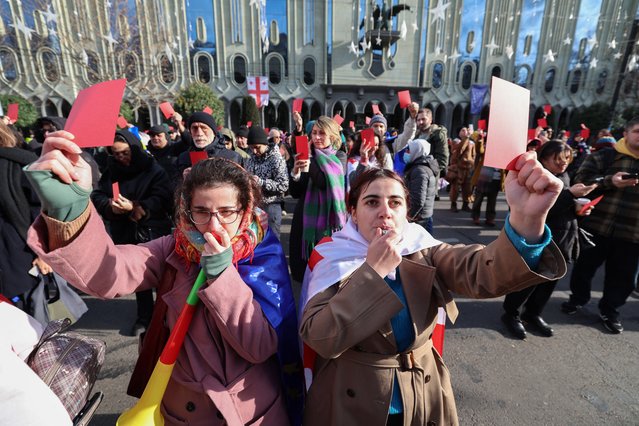 People attend a rally ahead of Georgian President-elect Mikheil Kavelashvili's inauguration in Tbilisi on December, 29, 2024. The far-right former footballer Mikheil Kavelashvili was sworn in at a parliamentary ceremony moments after outgoing president Salome Zurabishvili said she was the “only legitimate president” and vowed to fight on against the Georgian Dream party that controls parliament. (Photo by Giorgi Arjevanidze/AFP Photo)