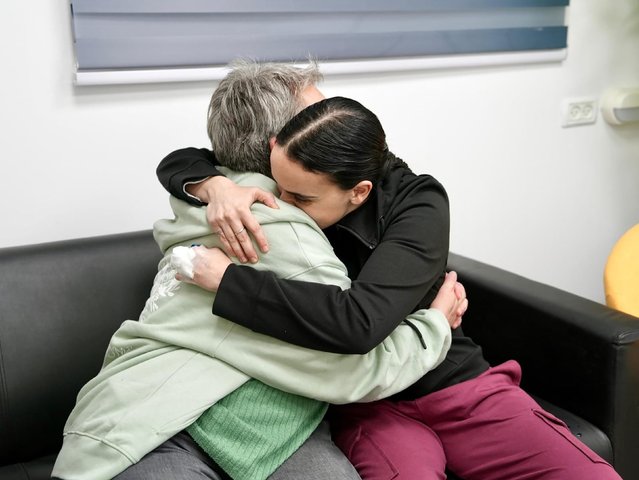 In this photo released by the Israeli military, Emily Damari, right, and her mother, Mandy, embrace near kibbutz Re’im, Israel, after Emily was released from captivity by Hamas militants in Gaza on Sunday, January 19, 2025. Three Israeli hostages and 90 Palestinian prisoners were released as part of the first phase of a long-awaited ceasefire deal between Hamas and Israel. (Photo by Israel Defense Forces)