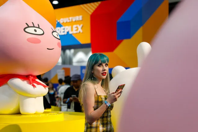 An attendee looks at a display at KCON USA, billed as the world's largest Korean culture convention and music festival, in Los Angeles, California on August 11, 2018. (Photo by Mike Blake/Reuters)