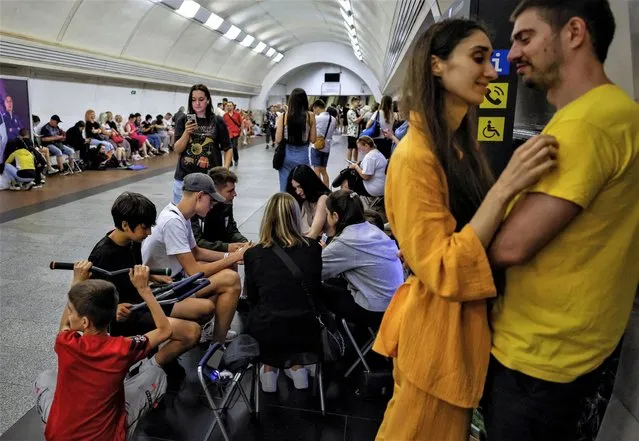 People take cover inside a subway station during an air raid alert, amid Russia's attack on Ukraine, in Kyiv, Ukraine on July 26, 2023. (Photo by Alina Smutko/Reuters)