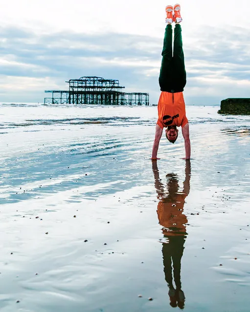 Brighton pier yoga. (Photo by Kristina Kashtanova/Caters News)