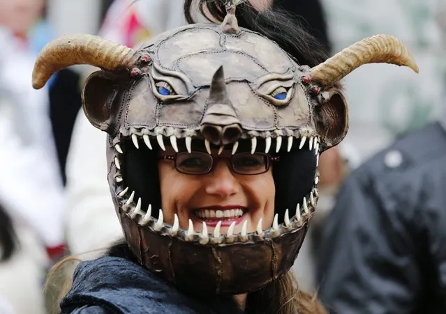 A carnival reveller wears a self-made Orc mask during the traditional Rose Monday carnival parade in the western German city of Cologne February 16, 2015. (Photo by Wolfgang Rattay/Reuters)