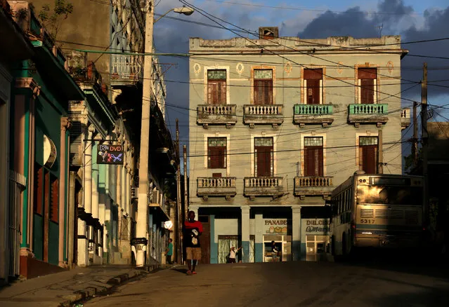 People walk on a street in Havana, Cuba November 27, 2016. (Photo by Enrique De La Osa/Reuters)