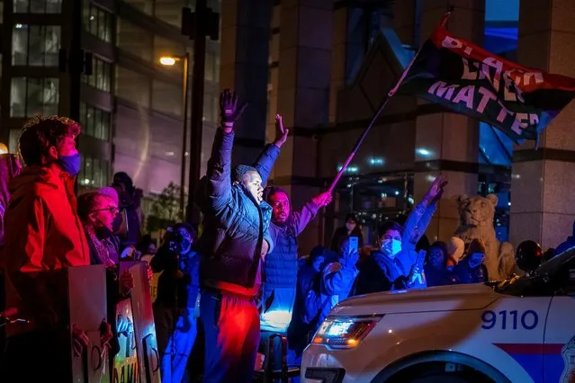 People attend a demonstration outside the Columbus Division of Police after an officer shot and killed a teenage girl in Columbus, Ohio, U.S., April 20, 2021. (Photo by Gaelen Morse/Reuters)