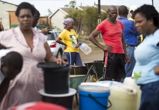 People queue to collect water from a tank as water to homes has been cut off due to the drought in KwaMsane, northeast of Durban, January 20, 2016. (Photo by Rogan Ward/Reuters)