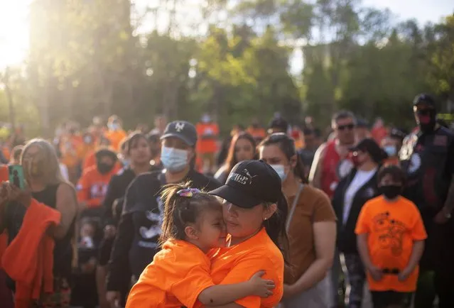 People gather in recognition of the discovery of children's remains at the site of a former residential school in Kamloops, B.C., in Edmonton Alta, on Monday, May 31, 2021. (Photo by Jason Franson/The Canadian Press)