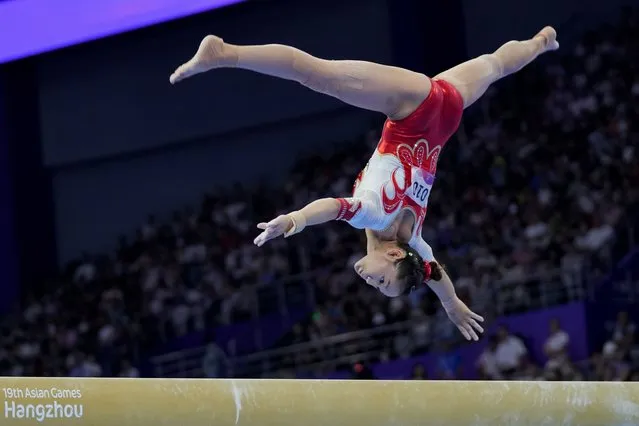 China's Xijing Tang competes in the Artistic Gymnastics women's balance beam final at 19th Asian Games in Hangzhou, China, Friday, September 29, 2023. Tang won the silver medal. (Phoot by Aijaz Rahi/AP Photo)