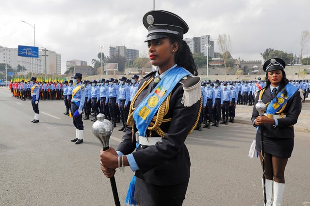 Addis Ababa police officers take part in a parade to display their new uniforms, and their readiness for the upcoming Ethiopian parliamentary and regional elections, in Addis Ababa, Ethiopia, June 19, 2021. (Photo by Baz Ratner/Reuters)