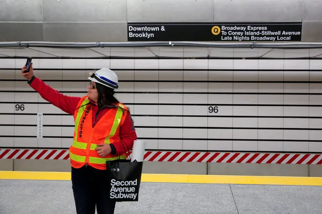 Angelika Glogowski, who worked on the project, takes a selfie at the 96th Street Station during a preview event for the Second Avenue subway line in Manhattan, New York City, U.S., December 22, 2016. (Photo by Andrew Kelly/Reuters)