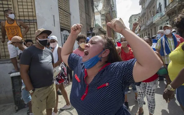 A woman shouts pro-government slogans as anti-government protesters march in Havana, Cuba, Sunday, July 11, 2021.  (Photo by Ismael Francisco/AP Photo)