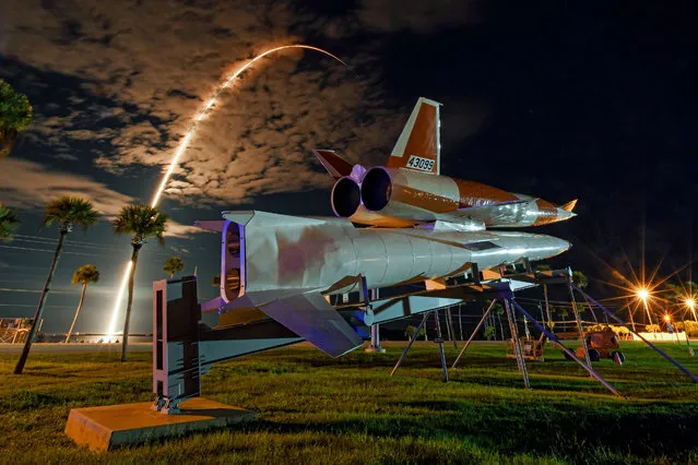 A distance from an historic display of a fifties era Navaho missile, a SpaceX Falcon 9 rocket lifts off on the 40th “Space Coast” launch of the year at 8:43 PM from the Cape Canaveral Space Force Station, Florida on Sunday, September 18, 2022. SpaceX launched another set of 54 Starlink satellites from Complex 40. (Photo by Joe Marino/UPI/Rex Features/Shutterstock)