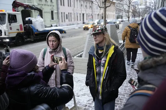 Activists speak to members of the media near the Russian Supreme Court after a hearing in Moscow, Russia, Thursday, November 30, 2023. (Photo by Alexander Zemlianichenko/AP Photo)