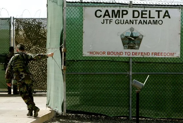 A U.S. Army soldier closes the gate at maximum security prison Camp Delta at Guantanamo Naval Base in Guantanamo, Cuba in this August 25, 2004 file photo. The Pentagon plan to close the U.S. prison in Guantanamo Bay, Cuba, references 13 potential sites for detainees to be transferred to U.S. soil but does not endorse a specific facility, administration officials said on Tuesday. (Photo by Mark Wilson/Reuters)