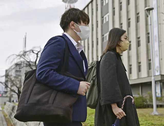 Rina Gonoi, left, former member of the Japan Ground Self-Defense Forces, arrives at the Fukushima District Court in Fukushima, northeastern Japan, Tuesday, December 12, 2023. A Japanese court on Tuesday convicted three former soldiers in a sexual assault case that authorities had dropped until the victim, a former service member, came forward demanding a reinvestigation, prompting a military-wide harassment probe.(Photo by Kyodo News via AP Photo)