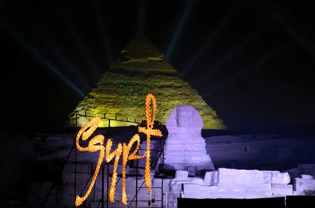 Lights shine on the Great Pyramids and Sphinx during New Year's Day celebrations on the outskirts of Cairo, Egypt, January 1, 2017. (Photo by Mohamed Abd El Ghany/Reuters)