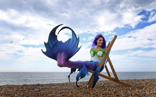 Mermaid Jasz Vegas poses on the beach during the changeable weather in Brighton, England on May 25, 2019 as Sea Life Brighton marks the opening of their day/night experience. (Photo by Gareth Fuller/PA Wire Press Association)