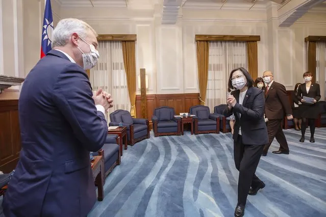 In this photo released by the Taiwan Presidential Office, Taiwan president Tsai Ing-wen, right, greets Francois de Rugy, the head of the Taiwan Friendship group in the National Assembly, the lower house of France's Parliament, during a visit at the Presidential Office in Taipei, Taiwan, December 16, 2021. Rugy is leading a team of French lawmakers from the French National Assembly on a five-day visit to Taiwan. (Photo by Taiwan Presidential Office via AP Photo)