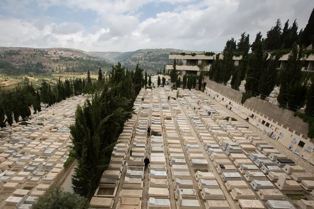Multi-level graves including aboveground and notched burial plots are seen at the Givat Shaul cemetery, on May 14, 2015, in Jerusalem, Israel. Underground cemetery being built by the Israeli Burial Society in Jerusalem due to a decrease in available land for traditional Jewish burials. (Photo by David Vaaknin/The Washington Post)