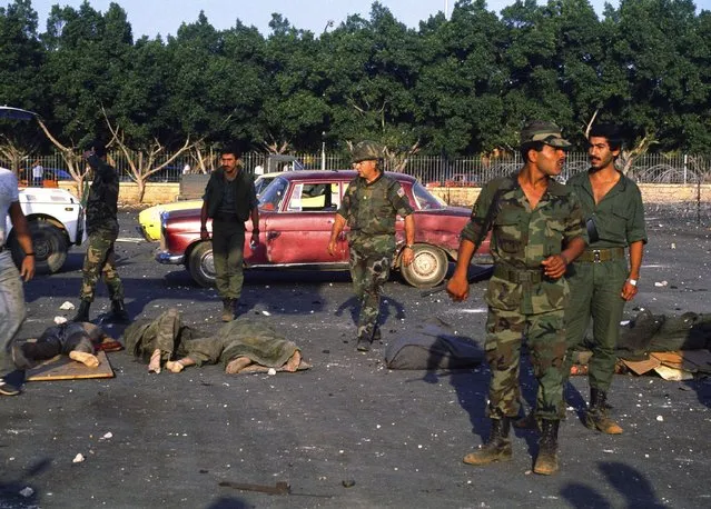 Bodies are removed from the U.S. Marine base near Beirut airport on October 23, 1983, following a massive bomb blast that destroyed the base and caused a huge death. Forty years after one of the deadliest attacks against U.S. troops in the Middle East, some warn that Washington could be sliding toward a new conflict in the region. (Photo by Hussein Ammar/AP Photo)