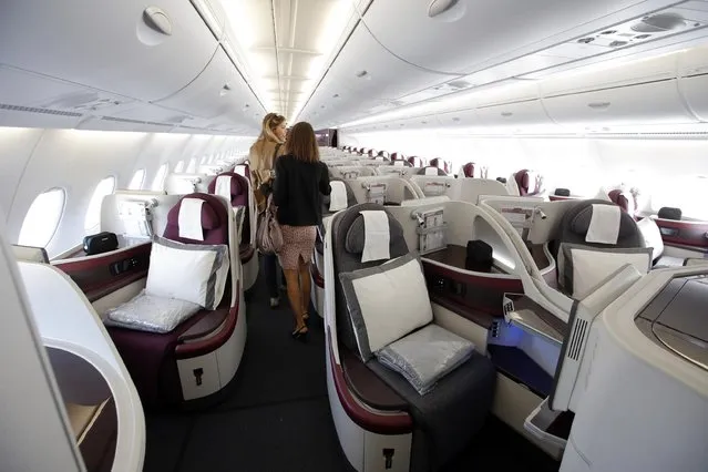 Interior view of the Business Class seats on the second floor deck of the Airbus A380 of Qatar Airways presented at the Paris Air Show, in Le Bourget airport, north of Paris, Wednesday, June 17, 2015. Qatar Airways has brought 4 Airbus A380's in service since last year. (AP Photo/Francois Mori)