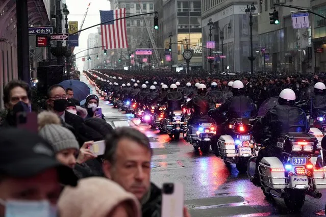 Police officers ride motorcycles during funeral service for New York City Police Department (NYPD) officer Jason Rivera, who was killed in the line of duty while responding to a domestic violence call, at St. Patrick's Cathedral in the Manhattan borough of New York City, U.S., January 28, 2022. (Photo by Jeenah Moon/Reuters)