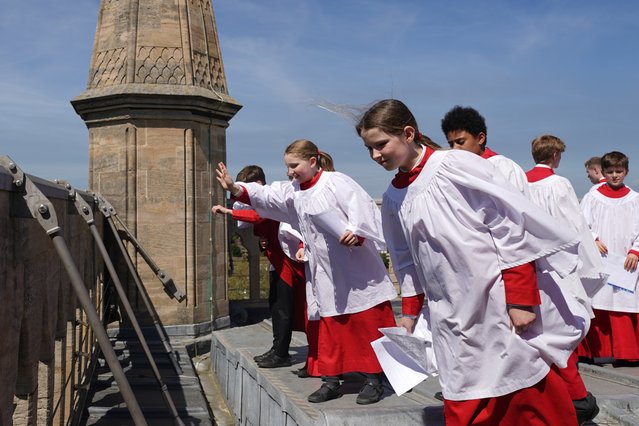 Choristers from the Choir of St John's College at the University of Cambridge look out from the top of the Chapel Tower before performing the Ascension Day carol on Thursday, May 9, 2024. (Photo by Joe Giddens/PA Images via Getty Images)