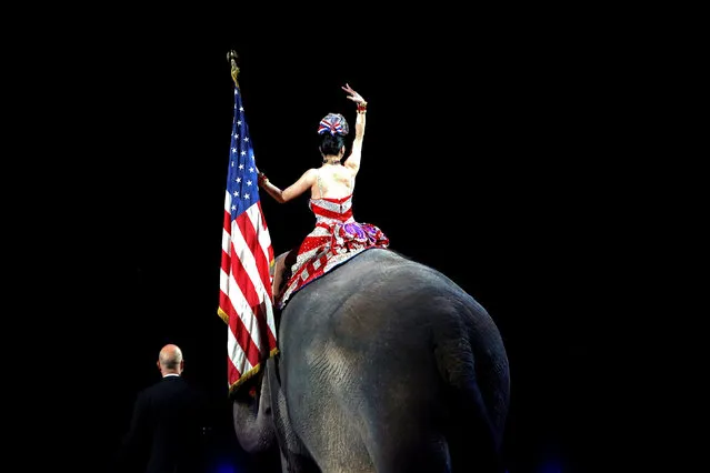 A performer waves as she rides an elephant during a performance in Ringling Bros and Barnum & Bailey Circus' “Circus Extreme” show at the Mohegan Sun Arena at Casey Plaza in Wilkes-Barre, Pennsylvania, U.S., April 29, 2016. (Photo by Andrew Kelly/Reuters)