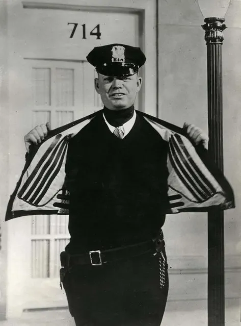 An American policeman wears an electrically warmed vest. The power is generated from the individuals movement along the street. Date: 1932. (Photo by Mary Evans Picture Library/Caters News)