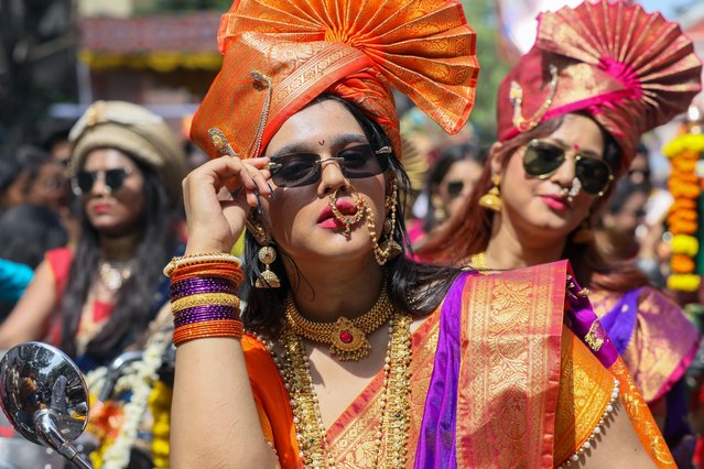 People in traditional clothes take part in a procession to celebrate the Gudi Padwa, Maharashtrian's New Year in Mumbai, India on March 22, 2023. Gudi Padwa is the Hindu festival that falls on the first day of Chaitra month and marks the beginning of the Lunar Calendar, which dictates the dates for all Hindu festivals, also known as Panchang. (Photo by Divyakant Solanki/EPA)