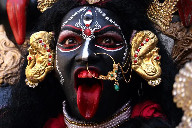 A devotee dressed as the Hindu deity Maha Kali performs during Navratri festival celebrations in Ajmer in Rajasthan state on October 3, 2019. (Photo by Himanshu Sharma/AFP Photo)