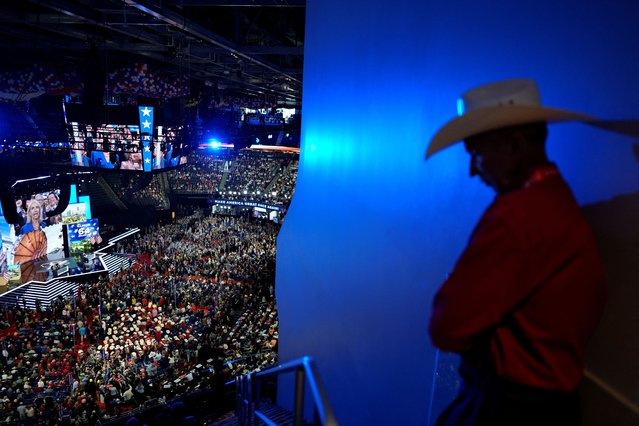 An attendee stands  on Day 1 of the RNC in Milwaukee on July 15, 2024. (Photo by Cheney Orr/Reuters)