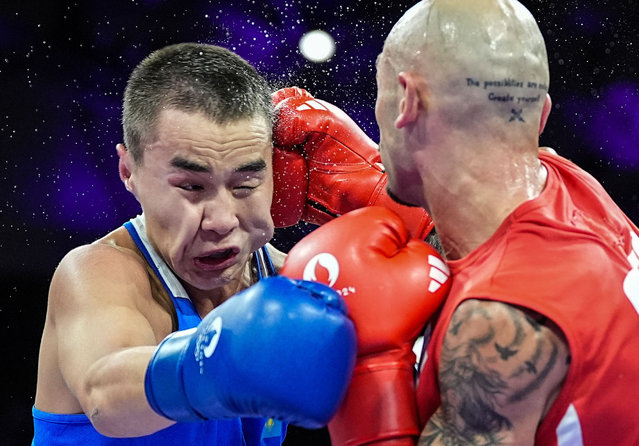 Lasha Guruli (R) of Georgia competes with Bazarbay Uulu Mukhammedsabyr of Kazakhstan during the men's 63.5kg quarterfinal of boxing at the Paris 2024 Olympic Games in Paris, France, August 1, 2024. (Photo by Xinhua News Agency/Rex Features/Shutterstock)