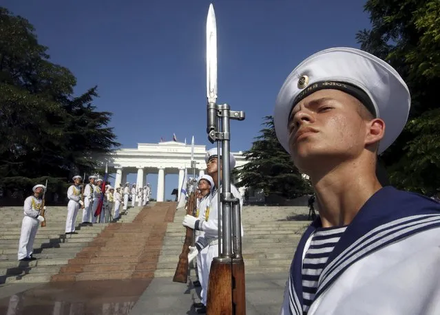 Russian navy sailors line up during celebrations for Navy Day in the Black Sea port of Sevastopol, Crimea, July 26, 2015. (Photo by Pavel Rebrov/Reuters)