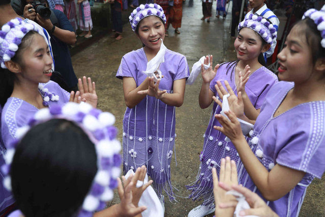 Ethnic Karen artists practice near the stage to perform during their traditional “Wrist Tying Ceremony” at National Race Village in Yangon, Myanmar, Saturday, August 17, 2024. (Phoot by Thein Zaw/AP Photo)