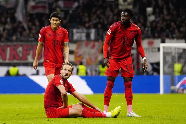 Kim Min-Jae, Harry Kane and Alphonso Davies of Bayern Munich look on during the Bundesliga match between Eintracht Frankfurt and FC Bayern Munchen at Deutsche Bank Park on October 06, 2024 in Frankfurt am Main, Germany. (Photo by M. Donato/FC Bayern via Getty Images)