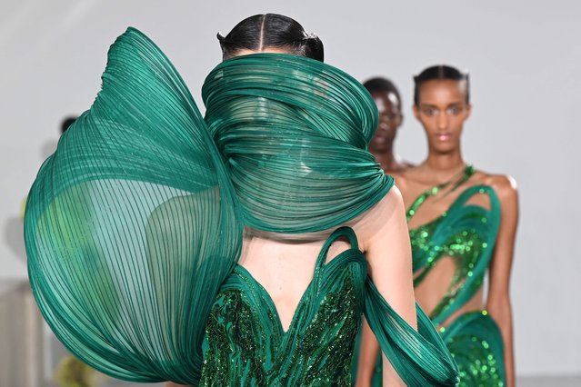 Models present creations a creation by Gaurav Gupta during the Women's Haute-Couture Fall/Winter 2023/2024 Fashion Week in Paris, on July 6, 2023. (Photo by Bertrand Guay/AFP Photo)