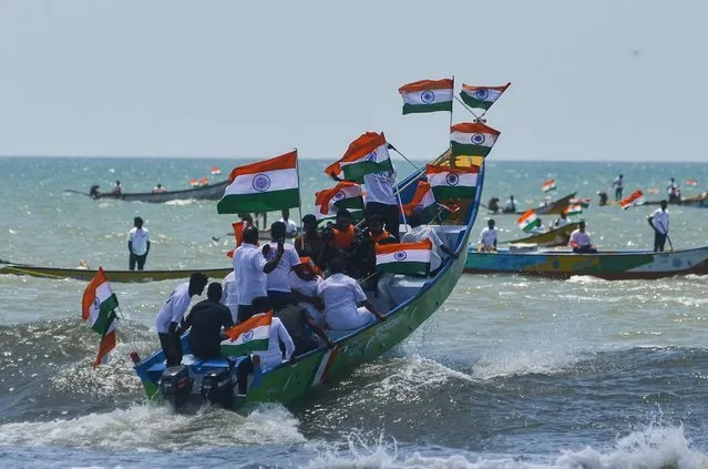 Supporters of the Bharatiya Janata Party (BJP) and Indian fishermen with their fishing boats tied up with the tricolored flags take part in a boat rally to celebrate the 75th Independence Day of India, at Neelangarai beach, in Chennai, India, 10 August 2022. More than a thousand fishermen with 250 fishing boats participated in a huge boat rally with tricolored Indian flags to celebrate the 75th Independence Day of India organized by the Bharatiya Janata Party (BJP) fishermen wing and members of the Tamil Nadu state fishermen organization at the Neelangarai Beach. Indian Prime Minister Narendra Modi has urged people to hoist the national flag in every household as part of a campaign called “Har Ghar Tiranga” (Tricolor in every house) during India's 75th Independence celebrations. India was declared independent of British colonialism on 15 August 1947. (Photo by Idrees Mohammed/EPA/EFE/Rex Features/Shutterstock)