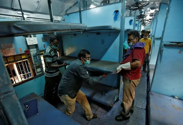 Workers remove berths from a passenger train to install as beds to set up an isolation facility in the train amid concerns about the spread of coronavirus disease (COVID-19), in Chennai, India, March 30, 2020. (Photo by P. Ravikumar/Reuters)