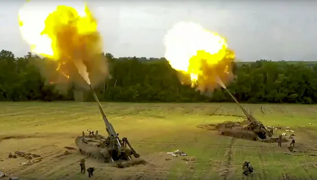 In this handout photo taken from video released by the Russian Defense Ministry Press Service on Thursday, August 25, 2022, Russian Malka artillery systems fire from an undisclosed location in Ukraine. (Photo by Russian Defense Ministry Press Service via AP Photo)