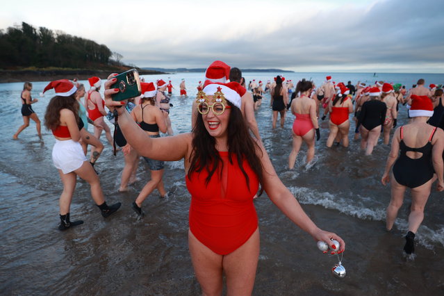 Laura Hawkins takes part in the annual Christmas Eve swim at Helen's Bay, Co Down, in aid of local charities on Tuesday, December 24, 2024. (Photo by Liam McBurney/PA Images via Getty Images)