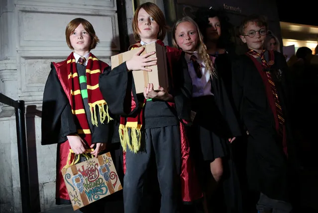 Fans queue at an event to mark the release of the book of the play of Harry Potter and the Cursed Child parts One and Two at a bookstore in London, Britain July 30, 2016. (Photo by Neil Hall/Reuters)