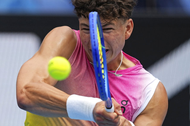 Ben Shelton of the U.S. plays a backhand return to Pablo Carreno Busta of Spain during their second round match at the Australian Open tennis championship in Melbourne, Australia, Thursday, January 16, 2025. (Photo by Vincent Thian/AP Photo)