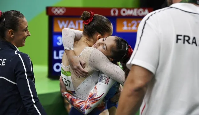 2016 Rio Olympics, Artistic Gymnastics, Preliminary, Women's Qualification, Subdivisions, Rio Olympic Arena, Rio de Janeiro, Brazil on August 7, 2016. Oreane Lechenault (FRA) of France hugs team mate Louise Vanhille (FRA) of France during the women's qualifications. (Photo by Dylan Martinez/Reuters)