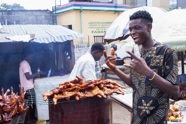 A man sells barbecued chicken at a market stall in Lagos, Nigeria, 04 February 2025. The surge in inflation rates and the Naira's depreciation is being felt across Nigeria, increasing the cost of food, transport, and energy prices. (Photo by Emmanuel Adegboye/EPA)