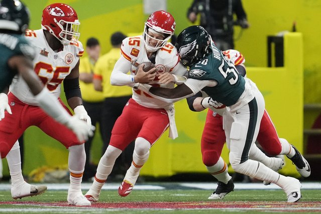 Kansas City Chiefs quarterback Patrick Mahomes (15) is hit by Philadelphia Eagles linebacker Jalyx Hunt, right, during the first half of the NFL Super Bowl 59 football game, Sunday, February 9, 2025, in New Orleans. (Photo by Ashley Landis/AP Photo)